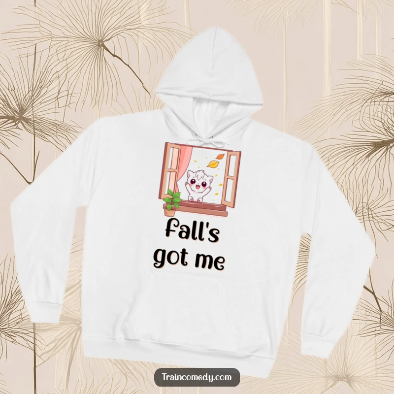Funny hoodie featuring a mischievous character trying to catch a falling leaf from a window, offering warmth and whimsical autumn vibes.