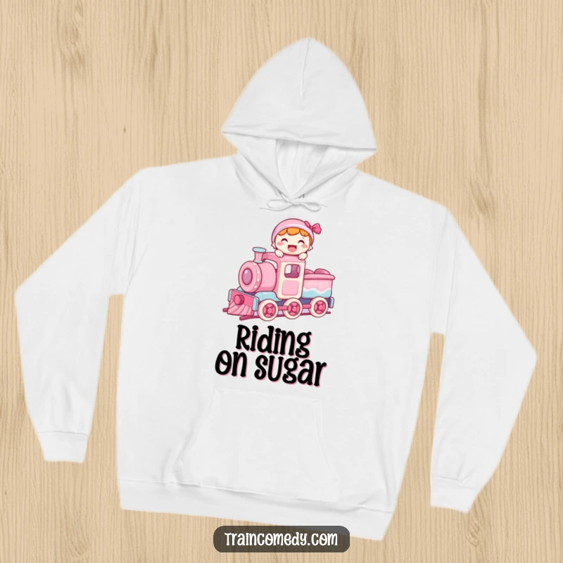 Funny hoodie showing a character with a joyful expression, balancing on the roof of a moving train car made of assorted candies.